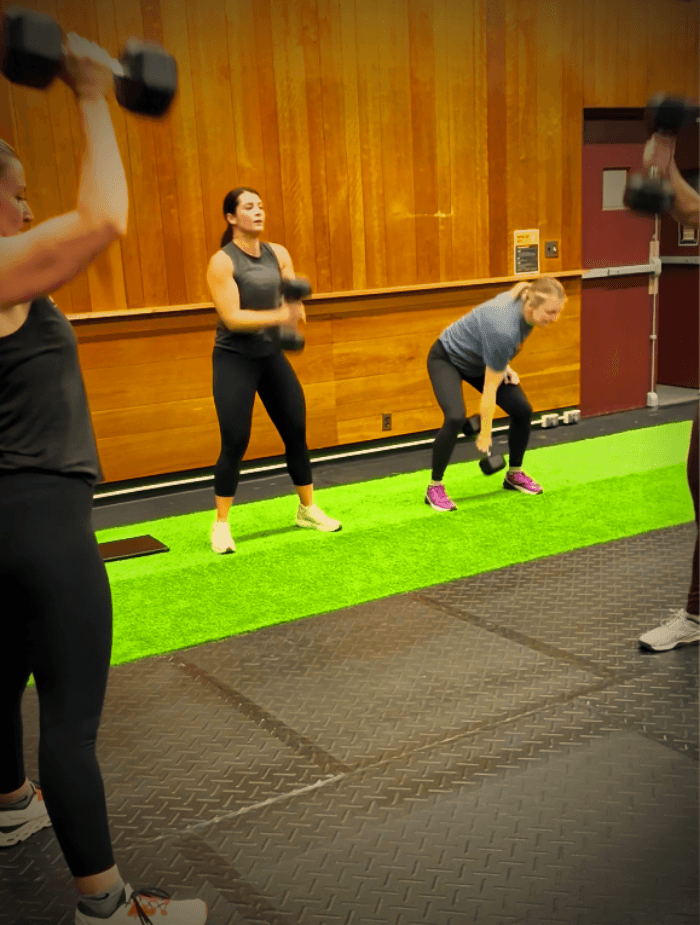 Coach working with an athlete at The Forge